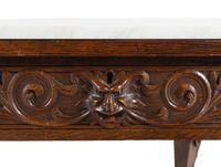 A Renaissance Style Carved Oak Marble-Top Low Table
