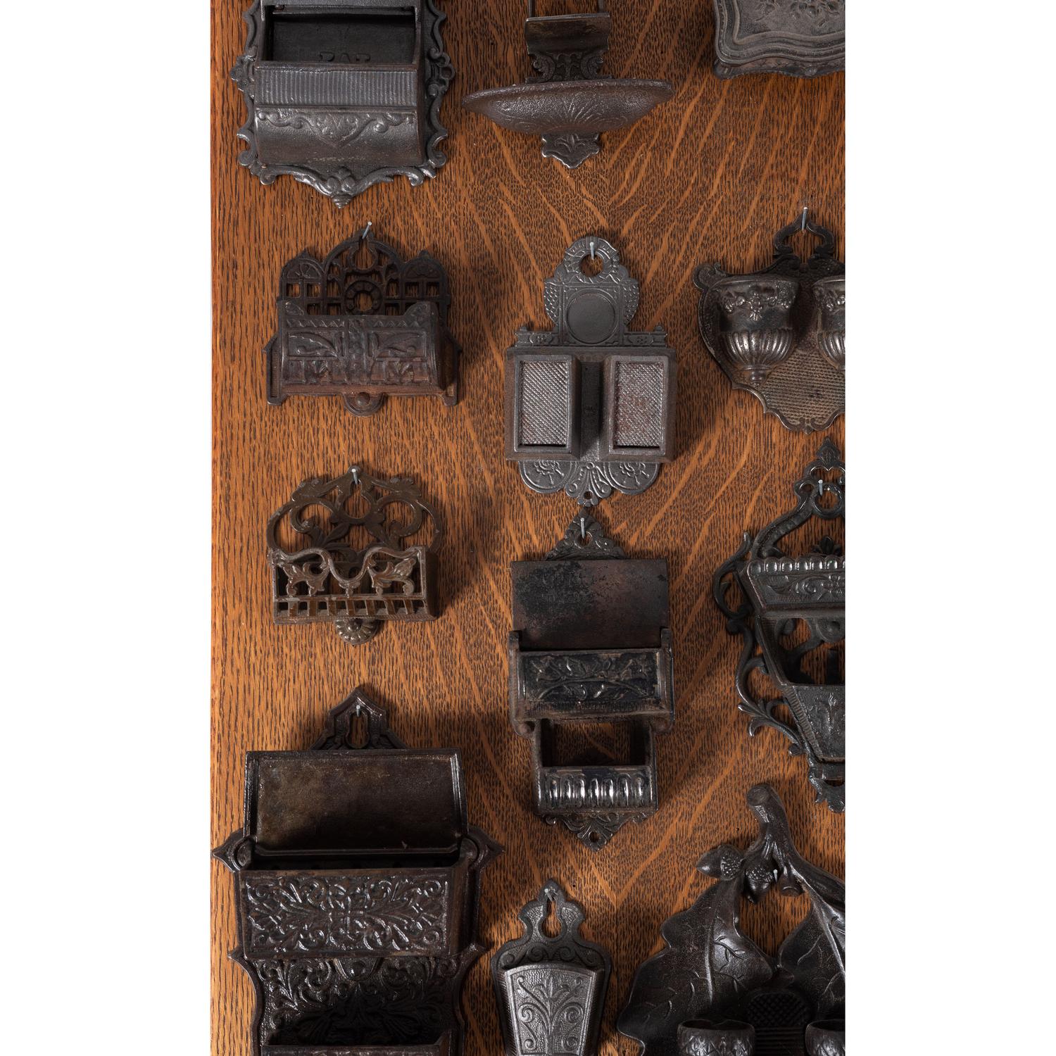 A Group of Cast Iron Hanging Match Holders