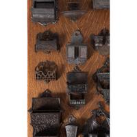 A Group of Cast Iron Hanging Match Holders
