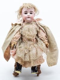 A German Bisque Headed Doll, Kestner Height of doll 22 inches.