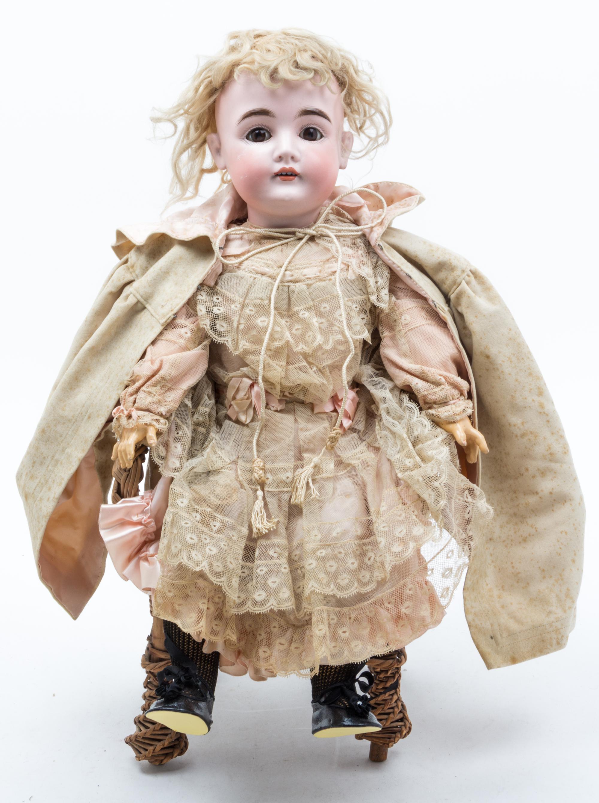 A German Bisque Headed Doll, Kestner Height of doll 22 inches.