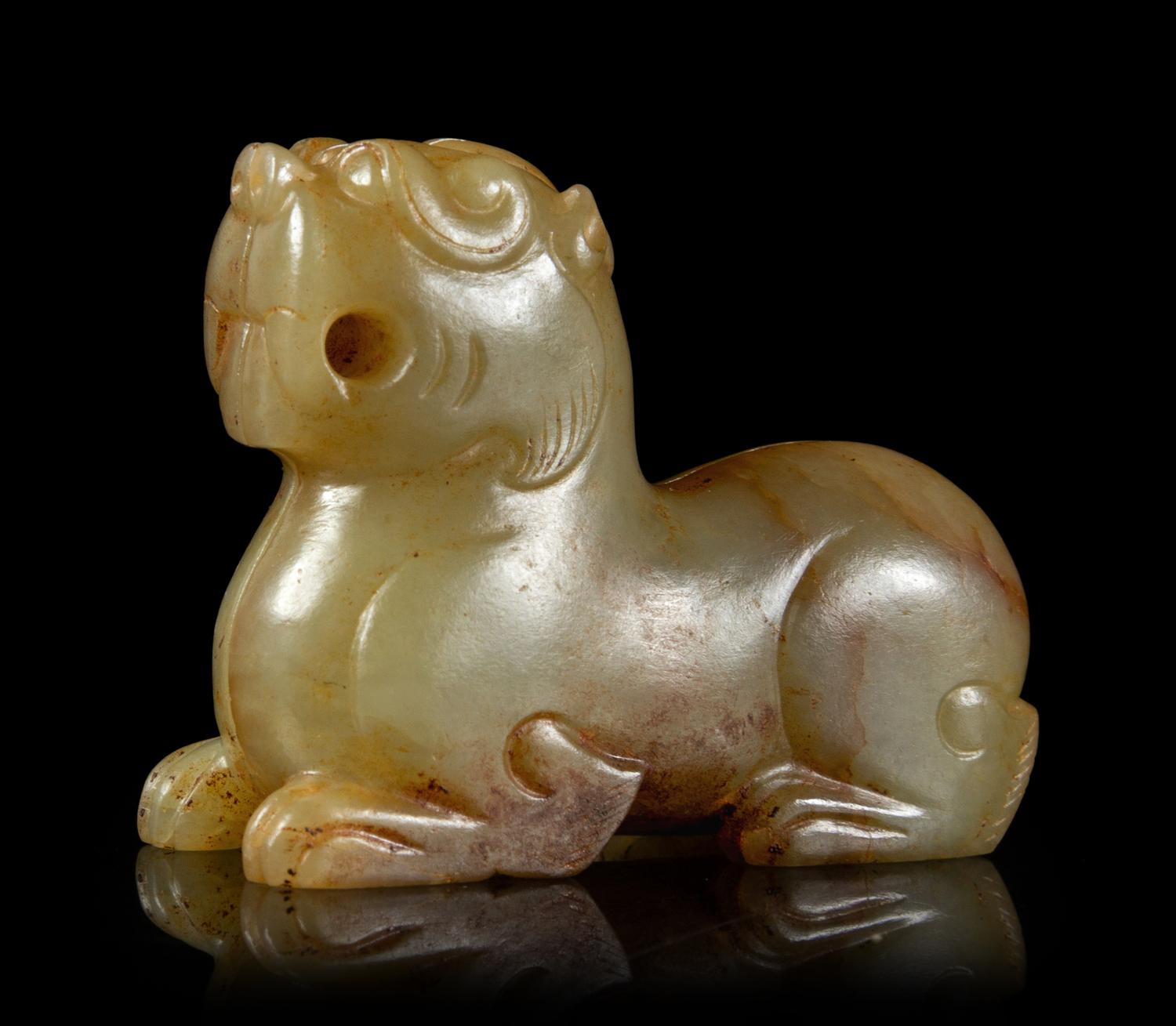 A Celadon and Russet Jade Mythical Beast