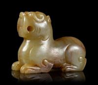 A Celadon and Russet Jade Mythical Beast