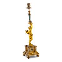 A French Gilt Bronze and Champlevé Figural Candlestick