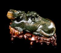 A Spinach Jade Figural Group of a Ox and a Frog Length 9 1/2 inches. — 20TH CENTURY