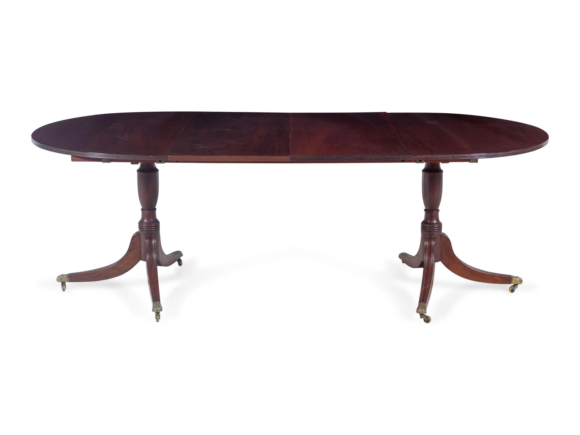A Regency Style Mahogany Double Pedestal Extension Dining Table — 20TH CENTURY
