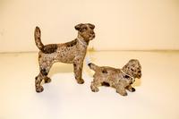 Two Cast Iron Figures Height of tallest 8 1/4 inches.