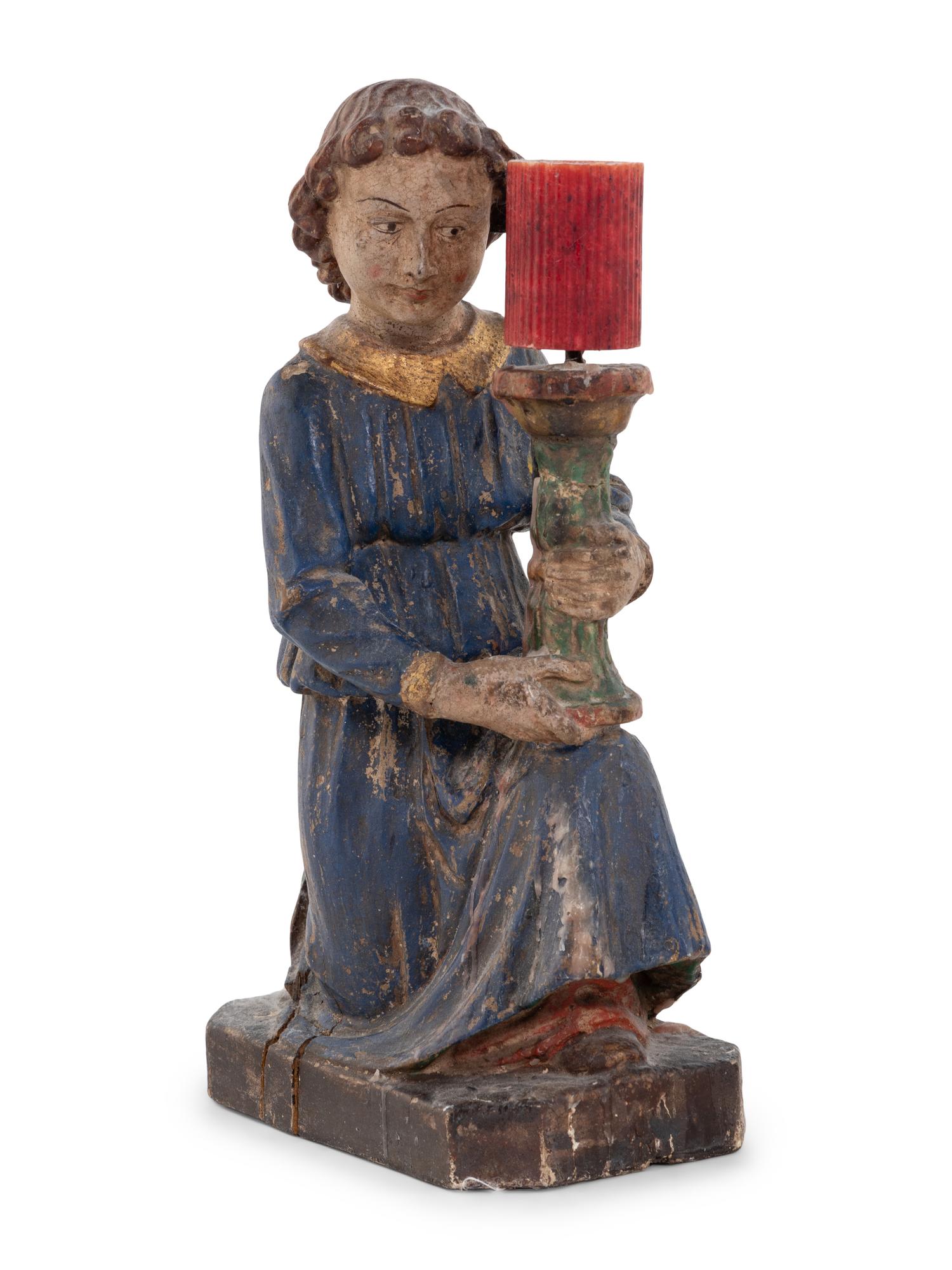 A Pair of Italian Carved and Polychrome Decorated Figural Candlesticks