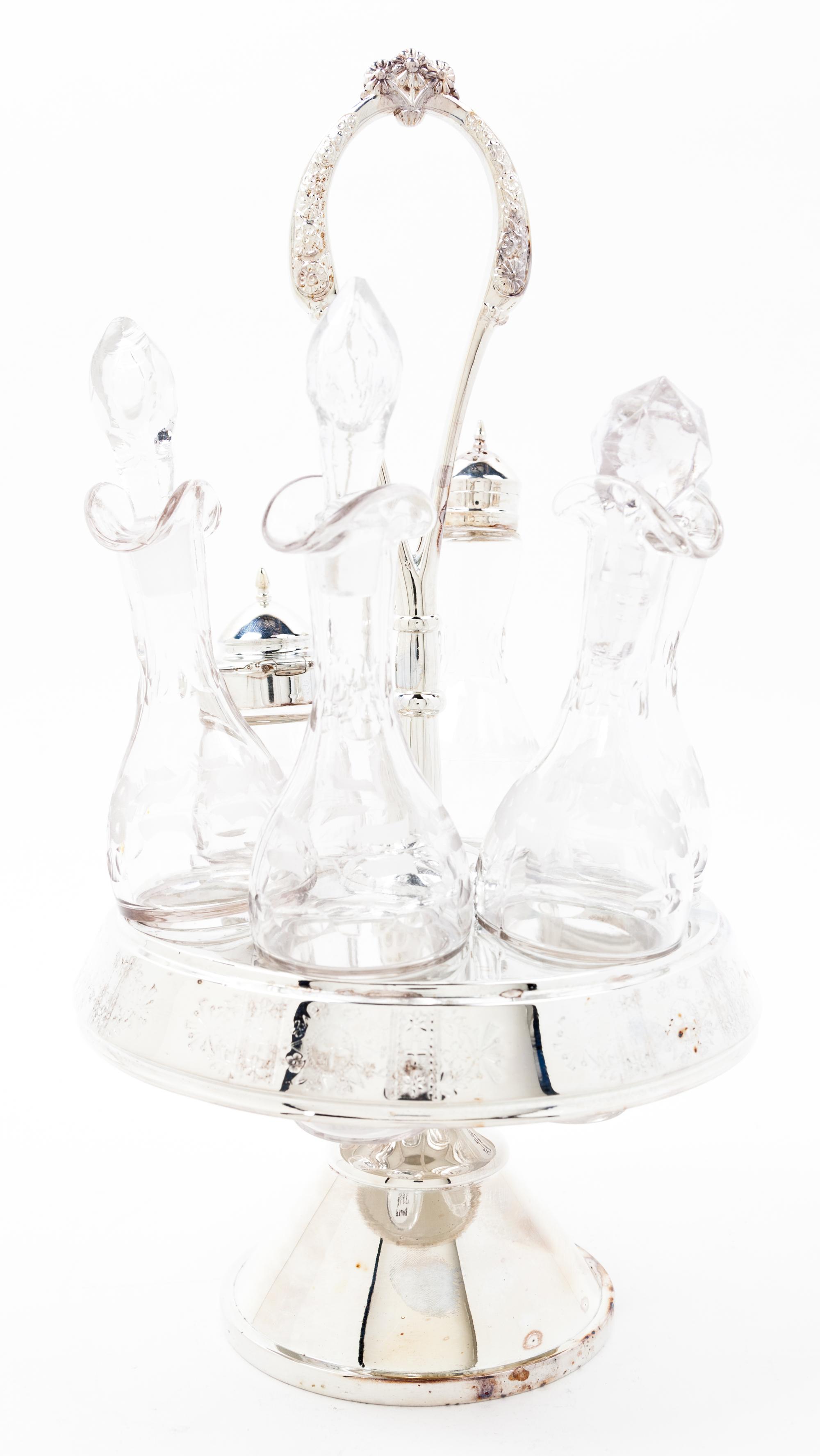 A Silver-plate Cruet Set Height of cruet stand overall 13 3/4 inches.