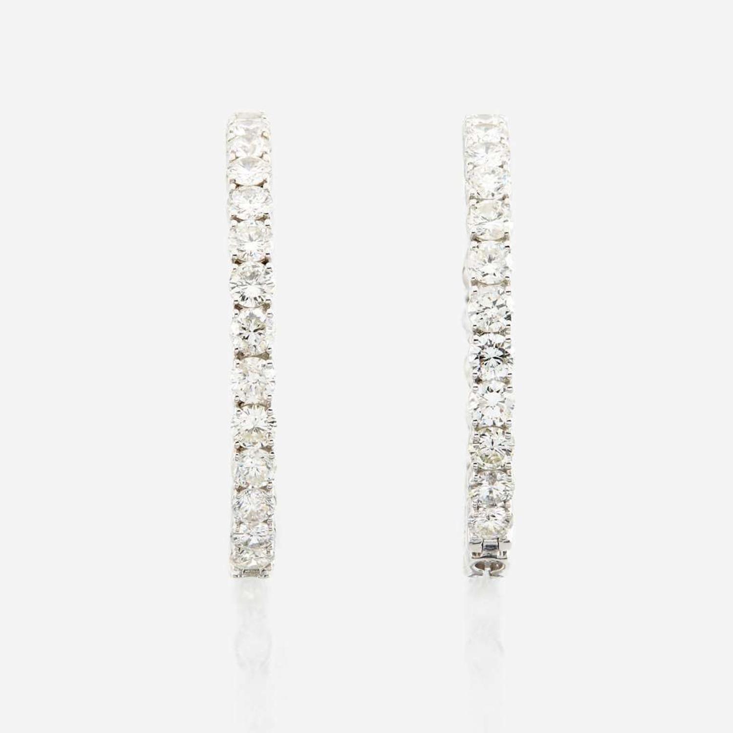 A pair of diamond and white gold earrings