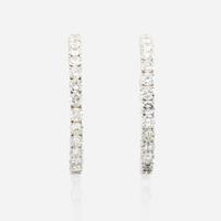 A pair of diamond and white gold earrings
