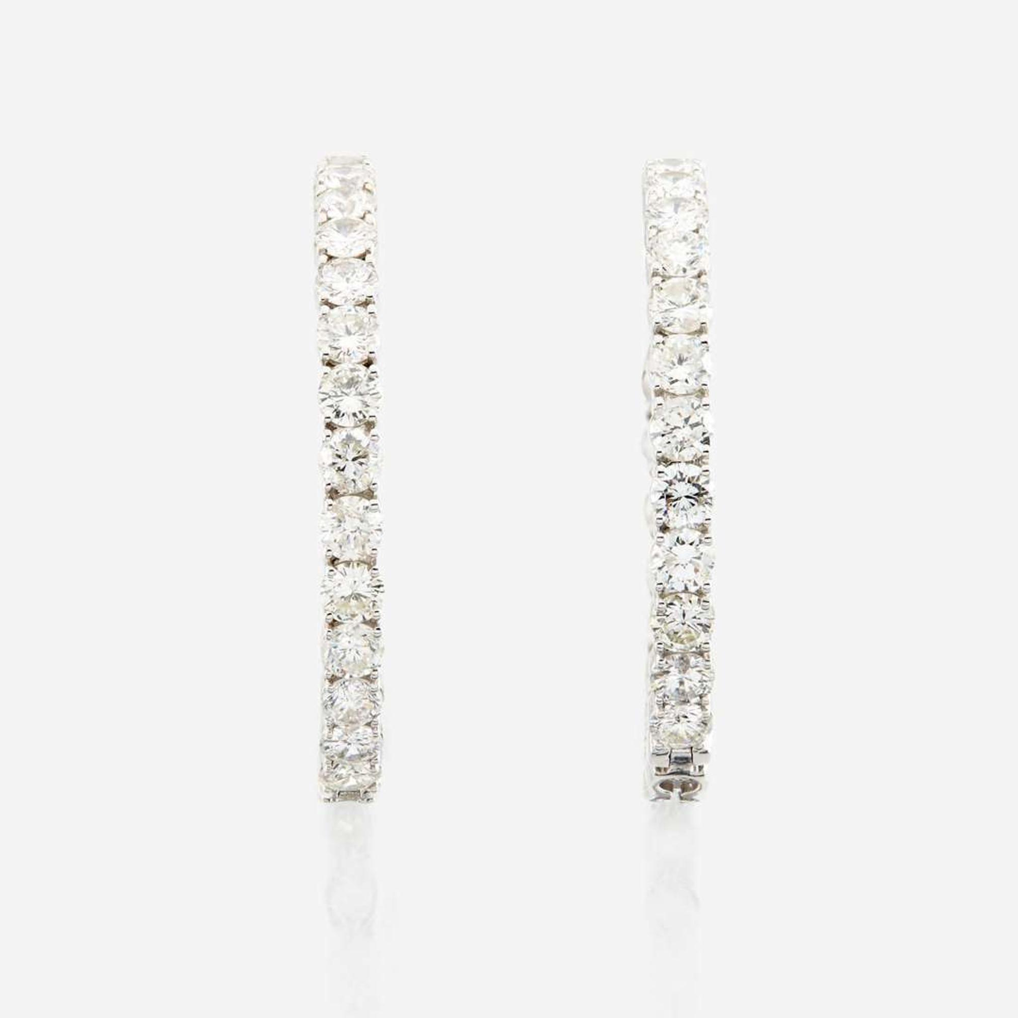 A pair of diamond and white gold earrings