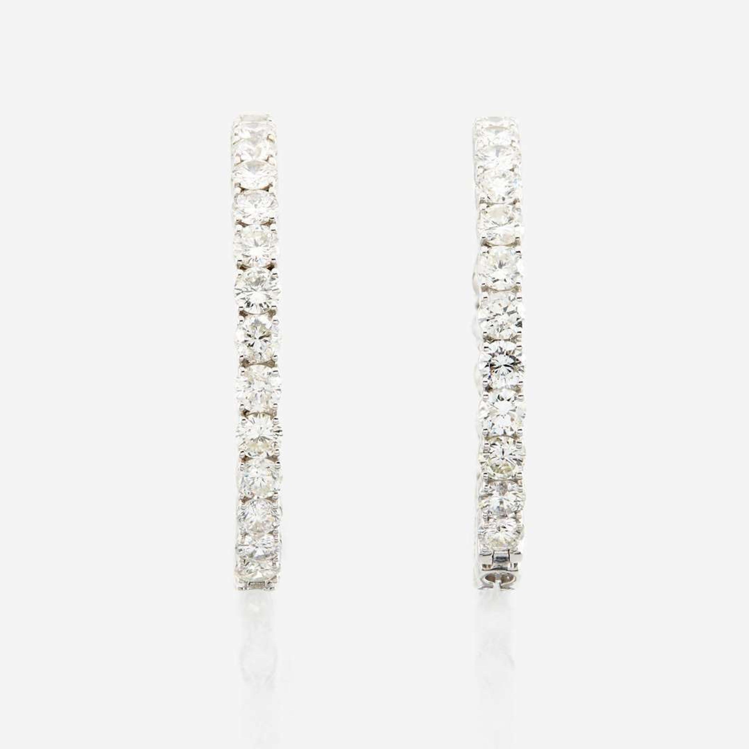A pair of diamond and white gold earrings