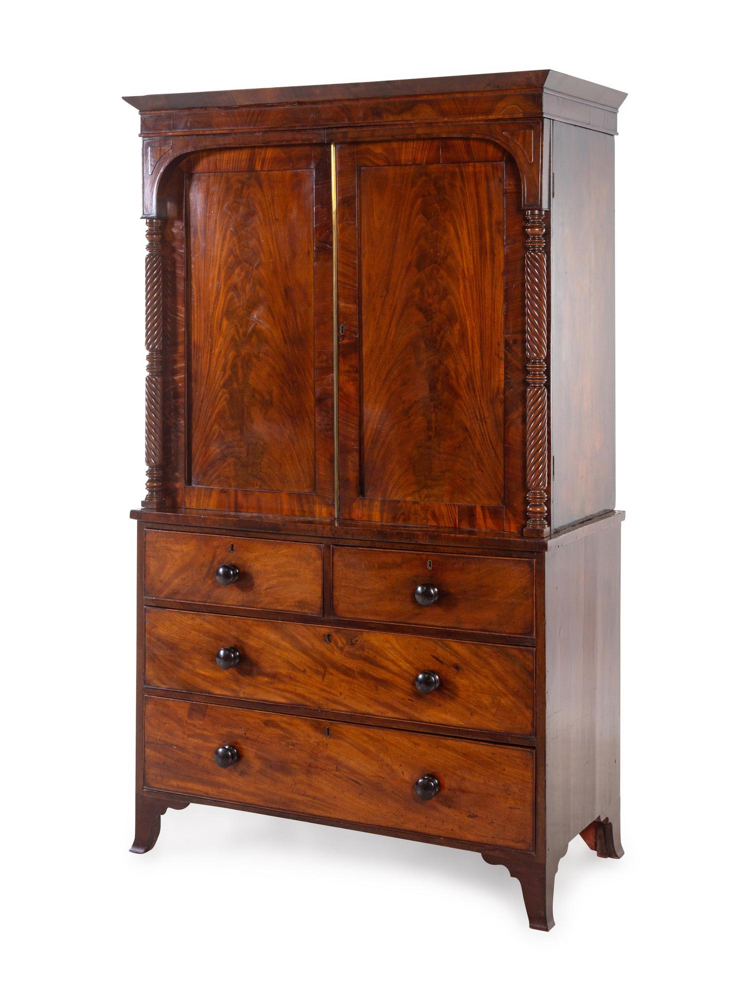 A George III Carved and Figured Mahogany Linen Press
