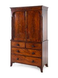 A George III Carved and Figured Mahogany Linen Press