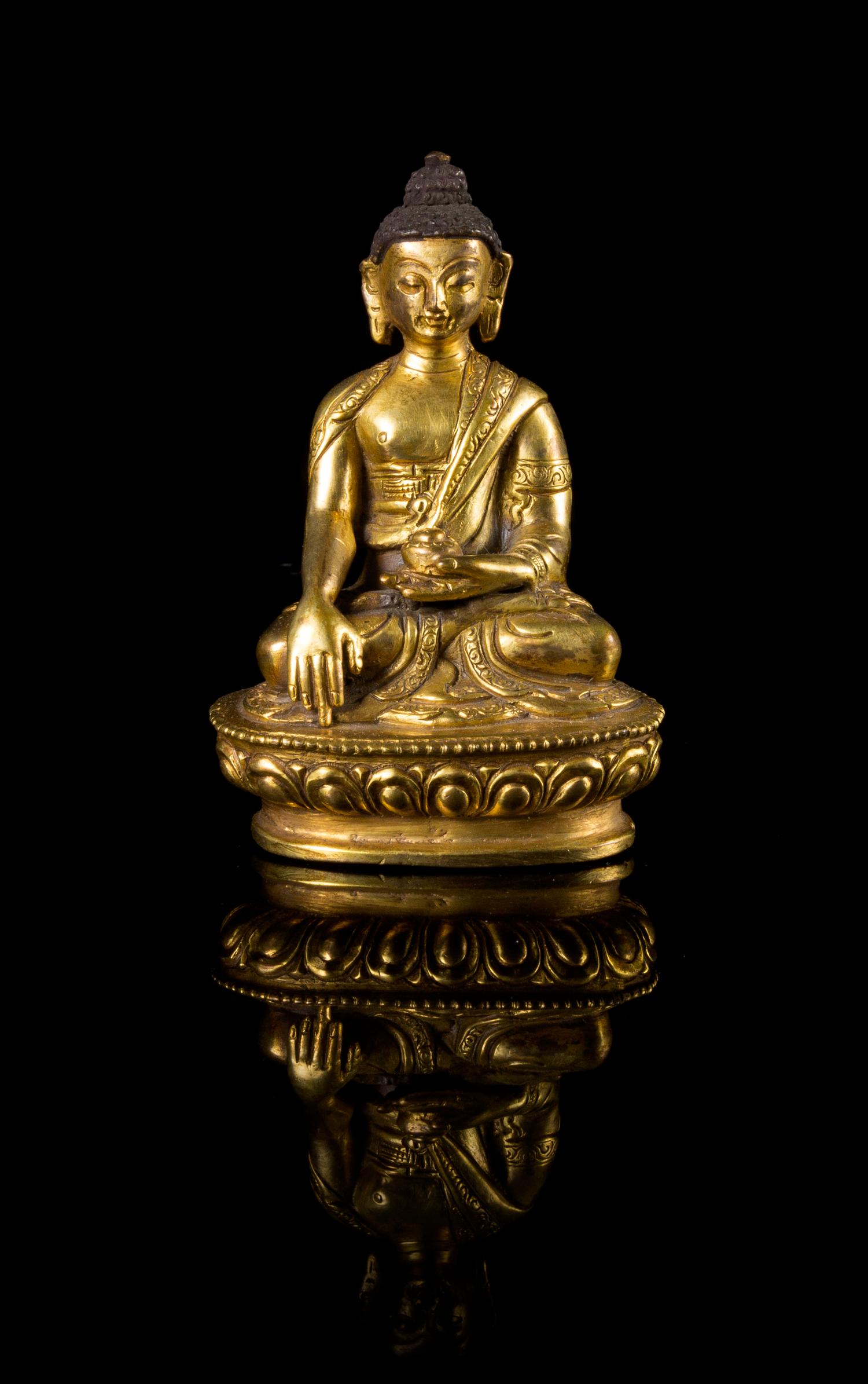 A Small Sino-Tibetan Gilt Bronze Figure of Buddha