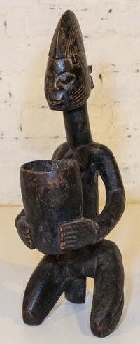 A Bakuba Style Vessel. Height 20 inches.