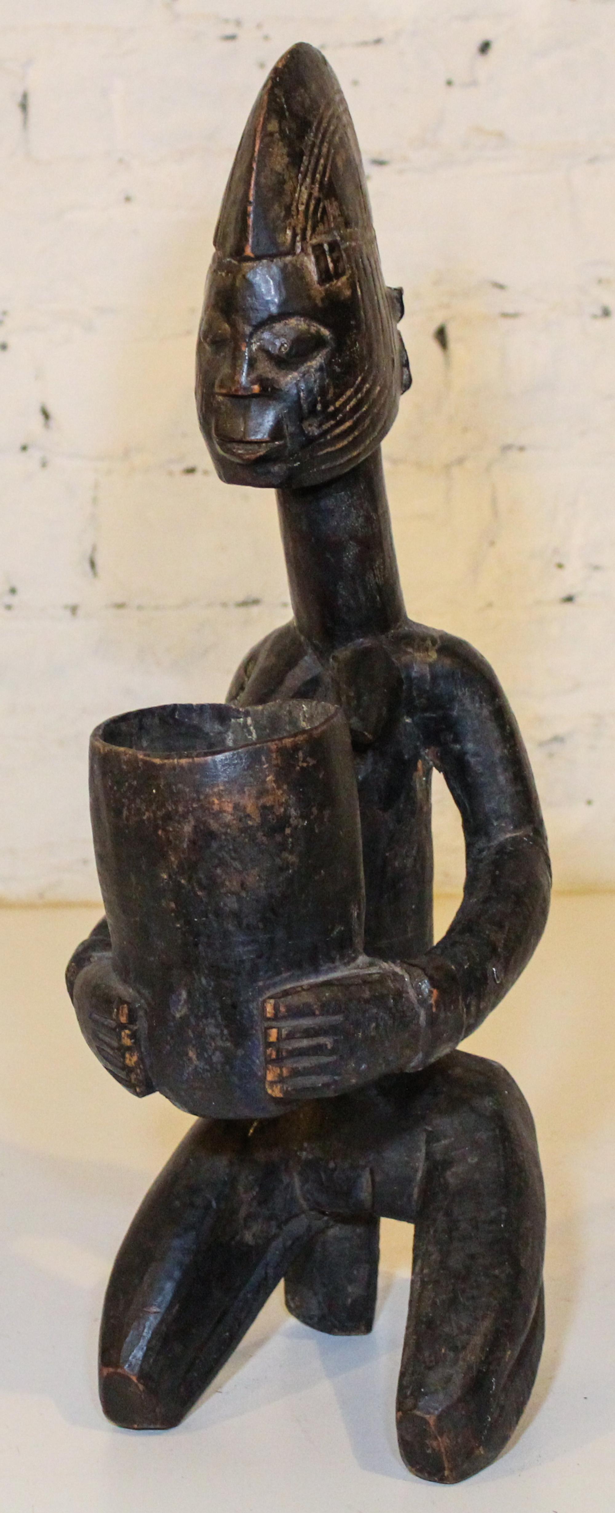 A Bakuba Style Vessel. Height 20 inches.