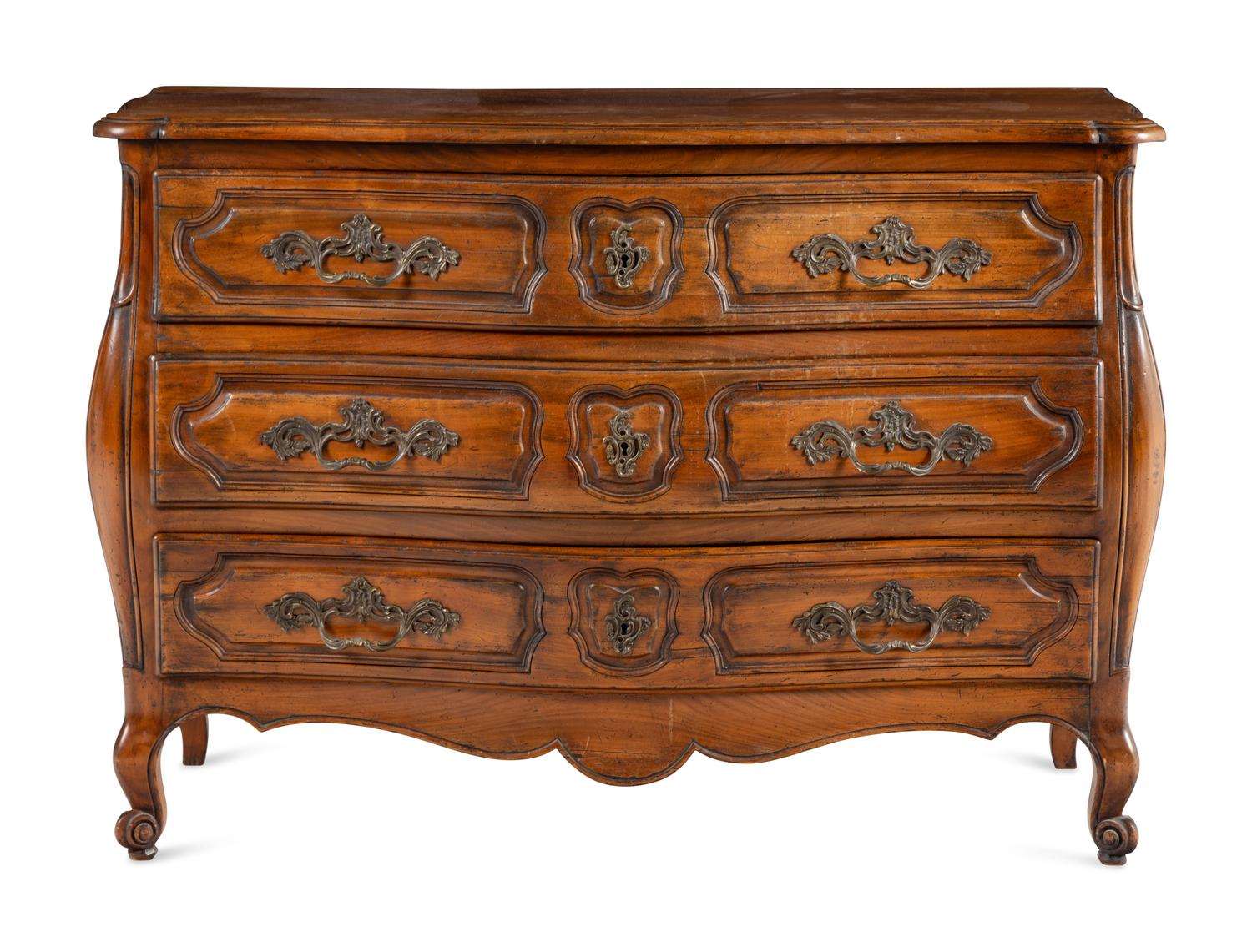 A Louis XV Style Walnut Bombe Commode