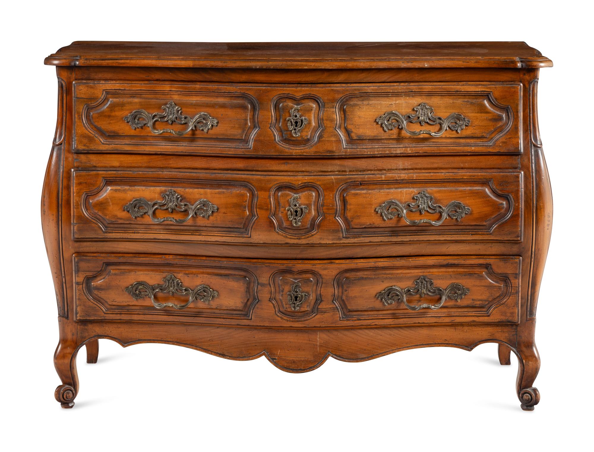 A Louis XV Style Walnut Bombe Commode