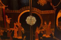 A Regency Style Black Japanned Bow-Front Cabinet