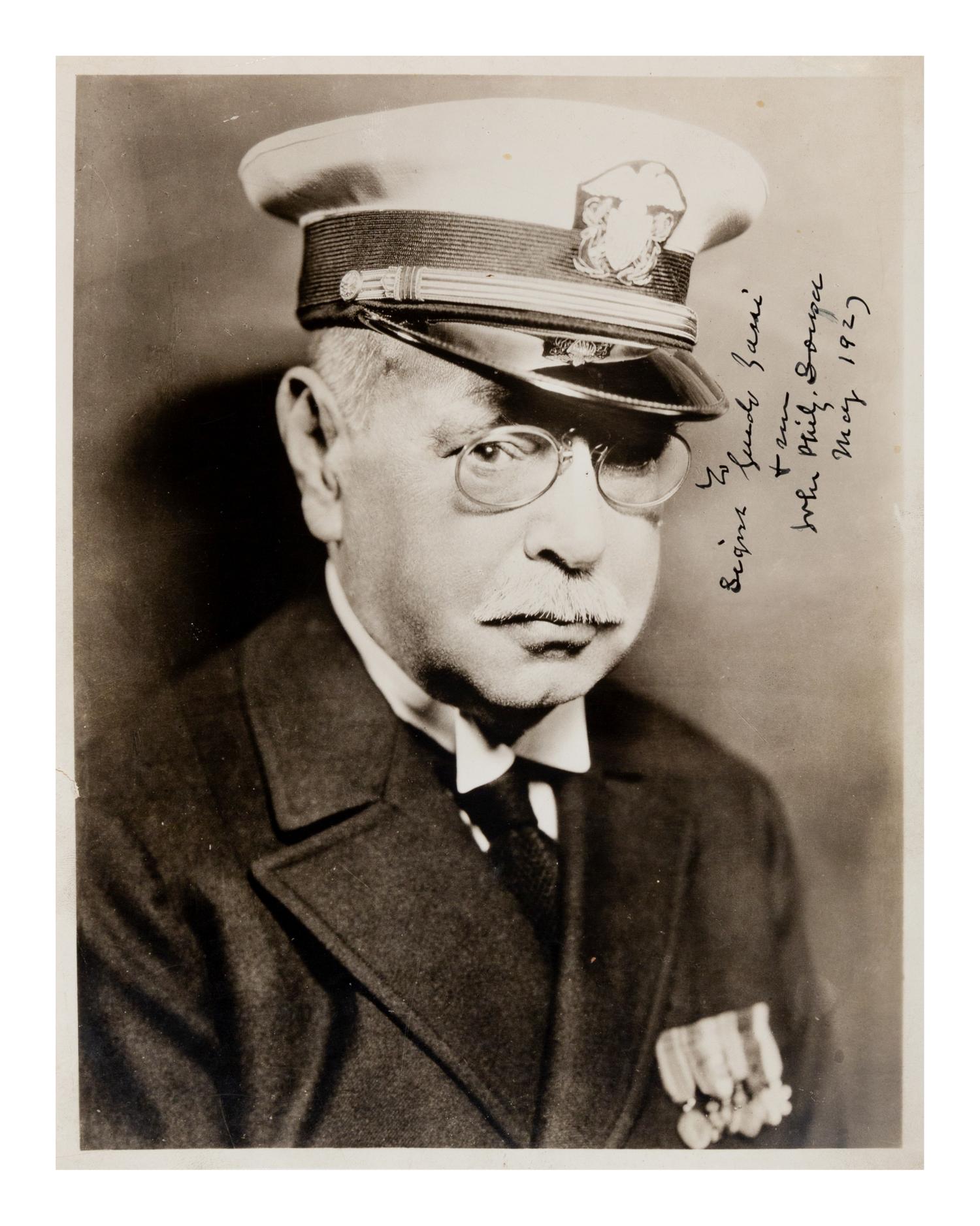 SOUSA, John Philip (1854-1932). Black and white photographic portrait signed (“John Philip Sousa”) and additionally inscribed, May 1927.