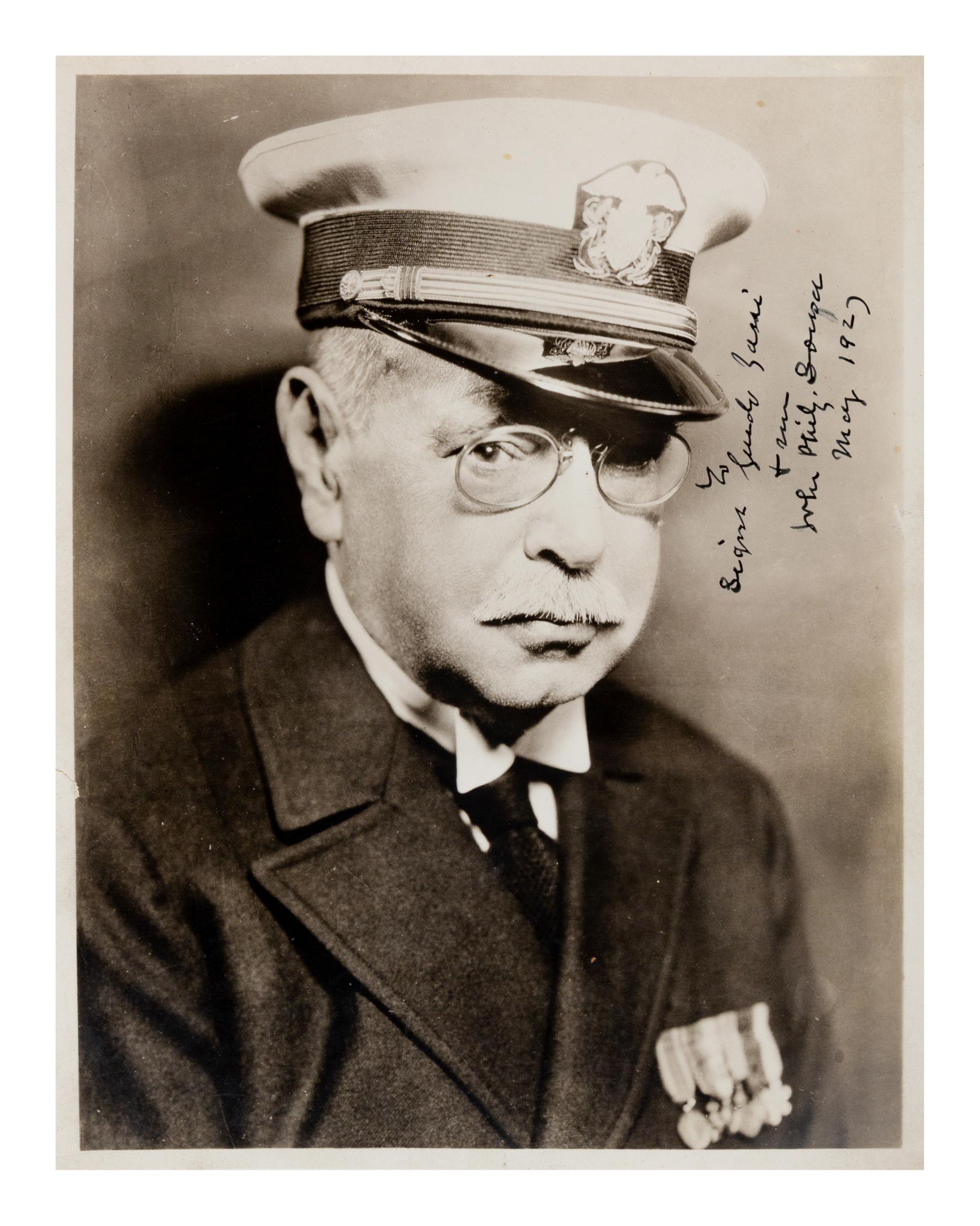 SOUSA, John Philip (1854-1932). Black and white photographic portrait signed (“John Philip Sousa”) and additionally inscribed, May 1927.