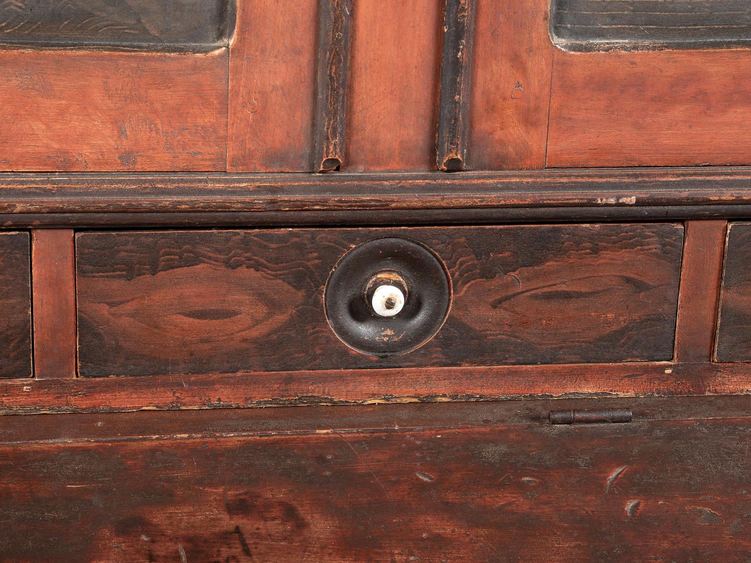 A Country Red and Grain Paint Decorated General Store Dry Goods Storage Cupboard