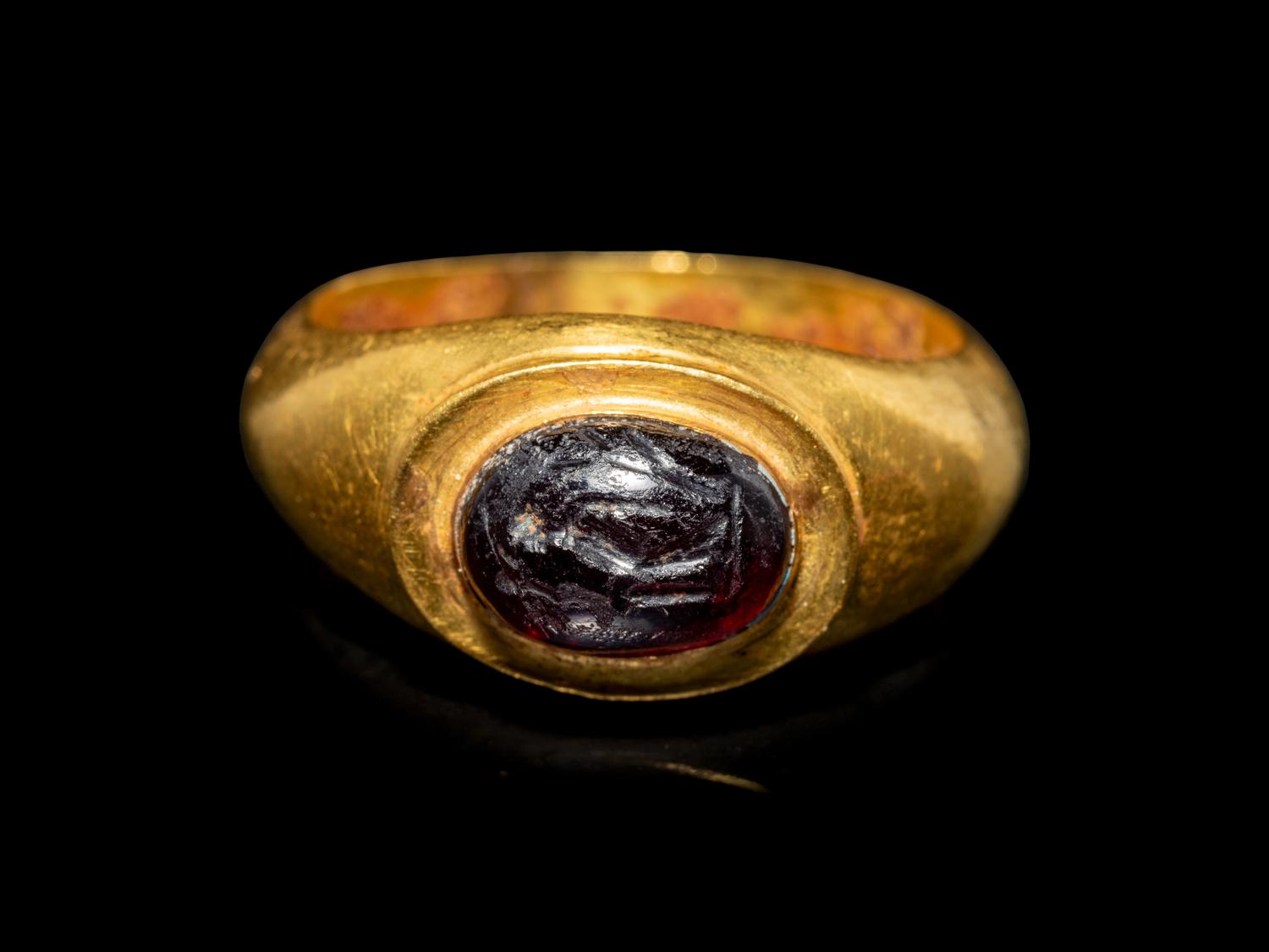 A Roman Gold and Garnet Finger Ring with the Goddesses Athena and Nike