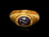 A Roman Gold and Garnet Finger Ring with the Goddesses Athena and Nike