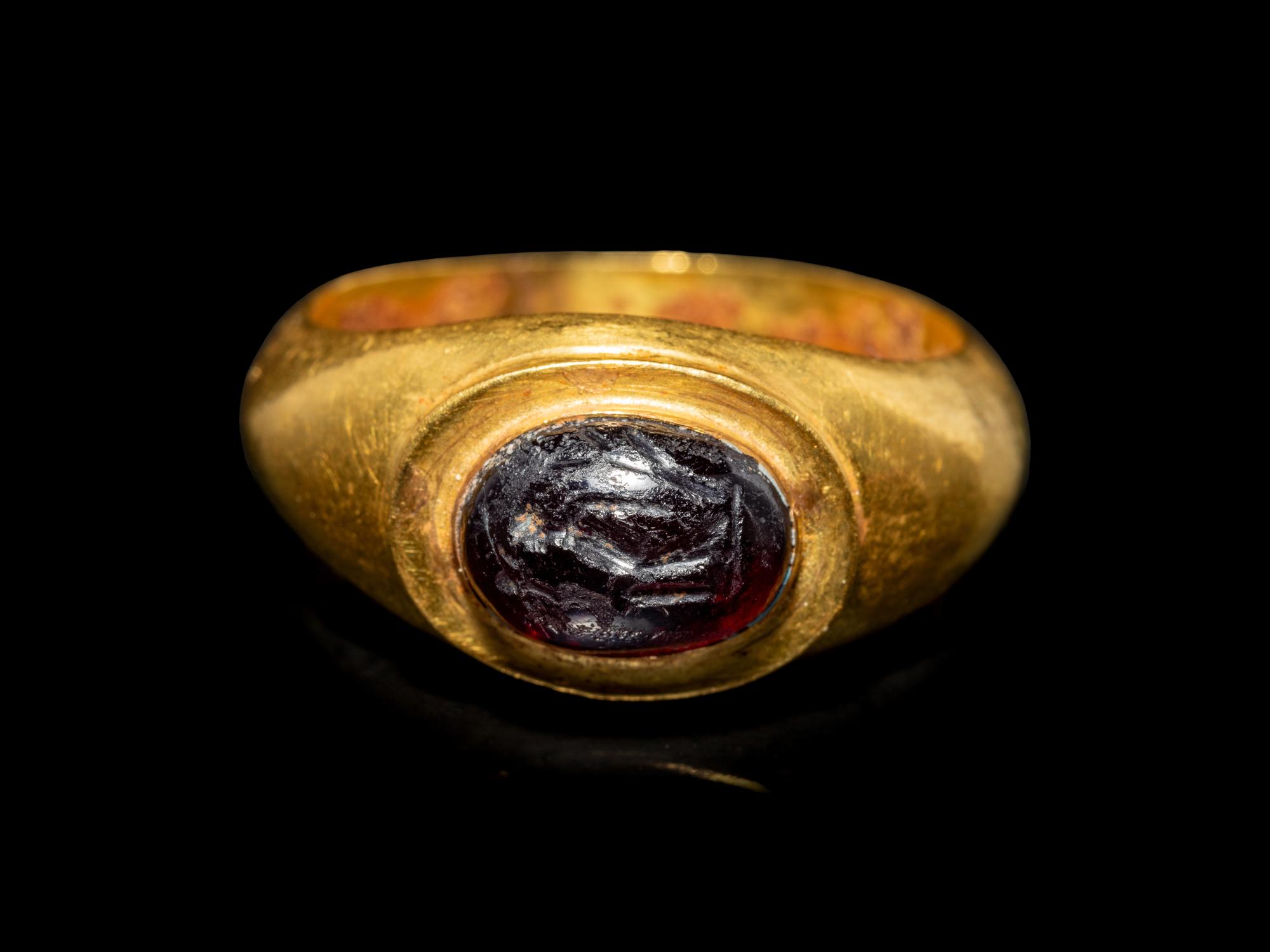 A Roman Gold and Garnet Finger Ring with the Goddesses Athena and Nike