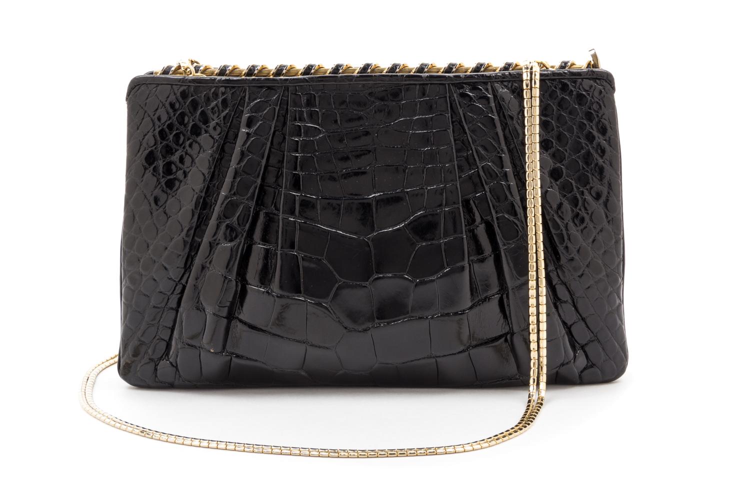 A Judith Leiber Black Alligator Clutch, 8.75" x 5.75" x 1.5".