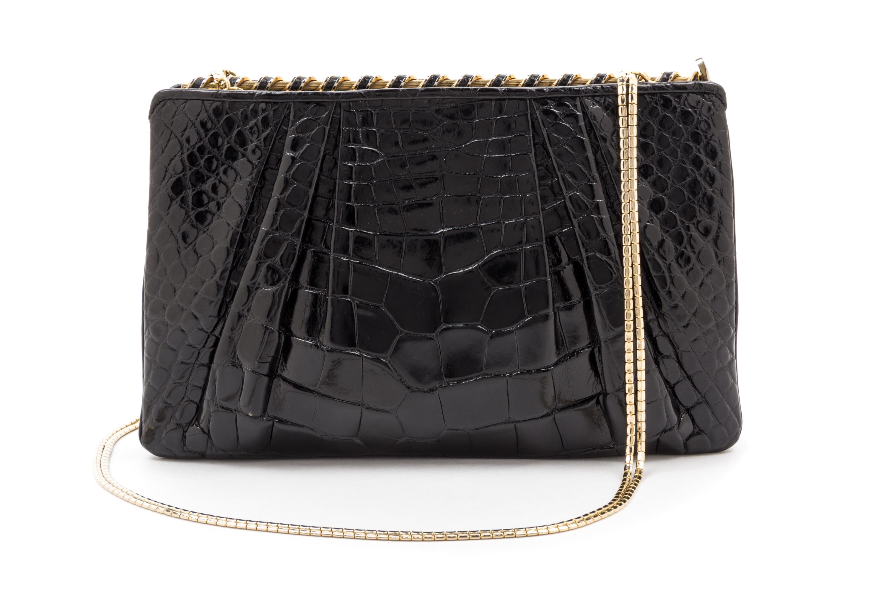 A Judith Leiber Black Alligator Clutch, 8.75" x 5.75" x 1.5".