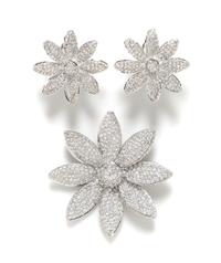 A Sterling Silver Rhinestone Floral Demi Parure, Brooch: 2.25" circumference; Earclip: 1.25".
