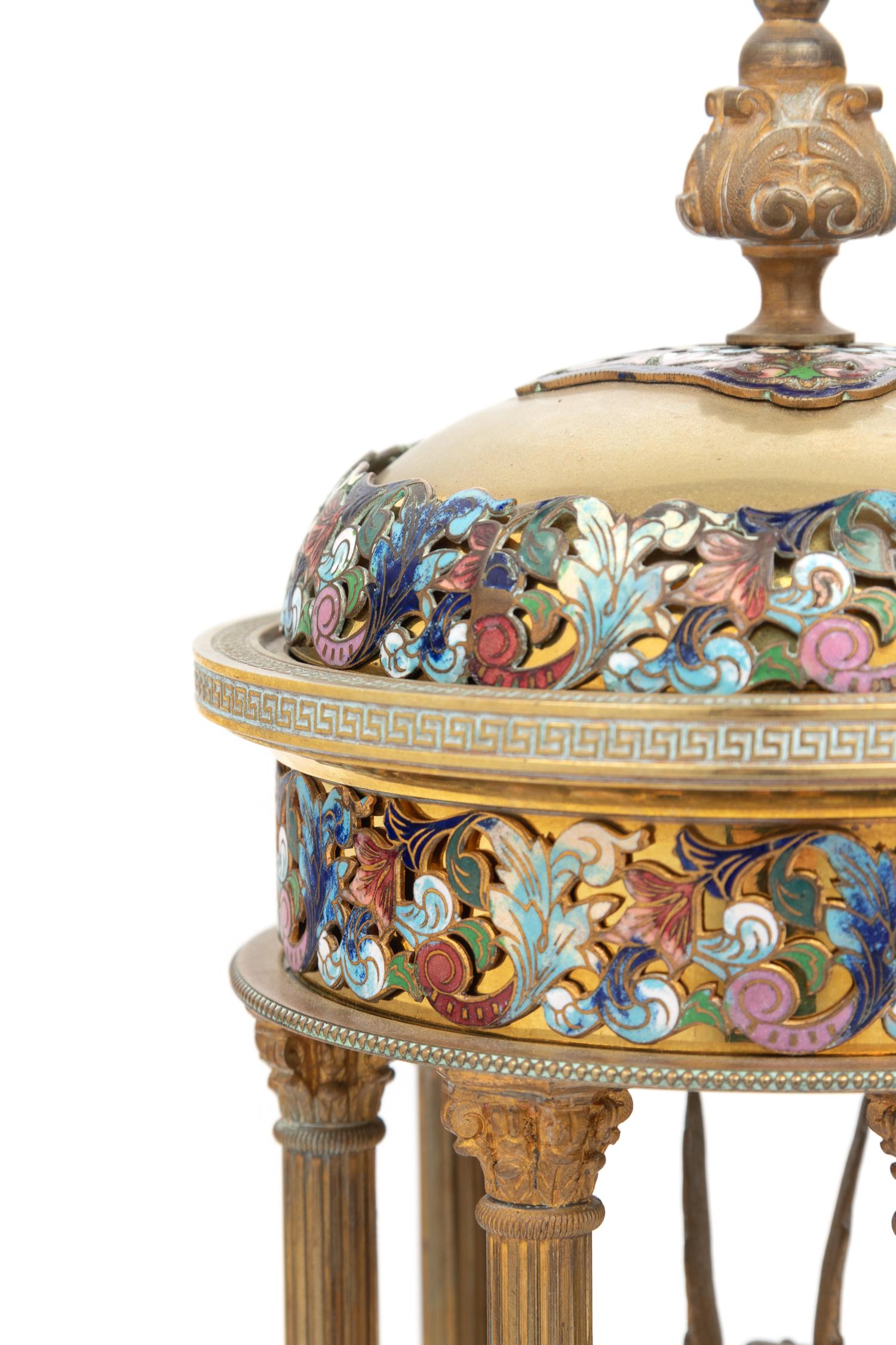 A Pair of French Gilt Bronze and Champlevé Enamel Stands with Interior Sphinxes