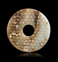 A Jade Bi Disc Diameter 2 3/4 inches. — HAN DYNASTY (206 B.C. - 220 A.D.)