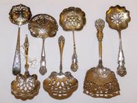 A Group of Seven American Silver Bonbon Spoons, Various Makers, two engraved with monograms.