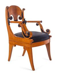 A Pair of Biedermeier Parcel Ebonized Armchairs