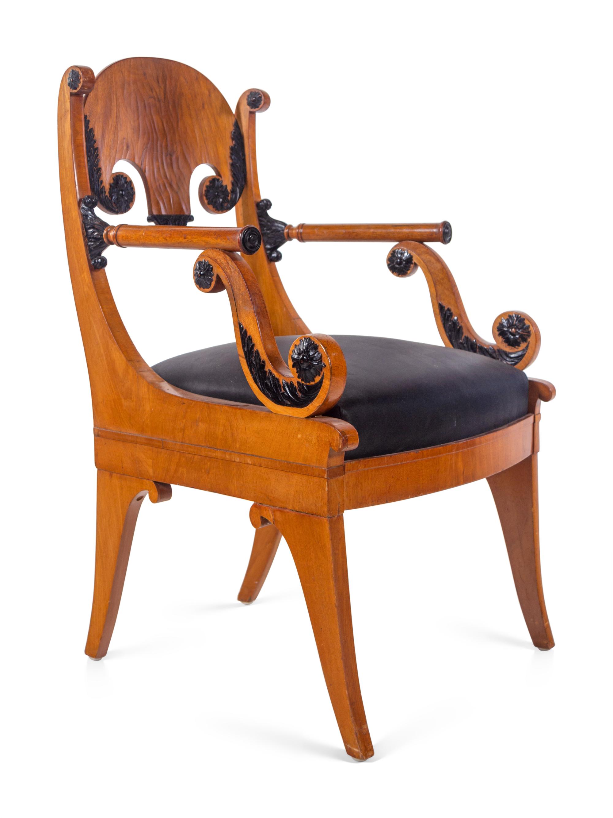 A Pair of Biedermeier Parcel Ebonized Armchairs
