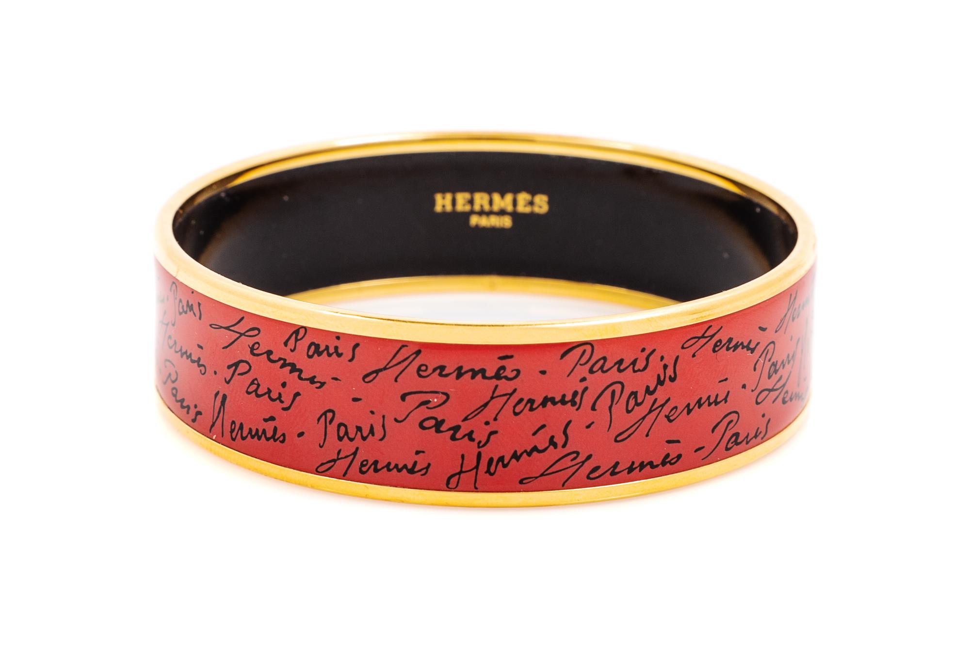An Hermès Red/Orange Enamel 65mm Bangle, 6.5cm diameter, .75" W.