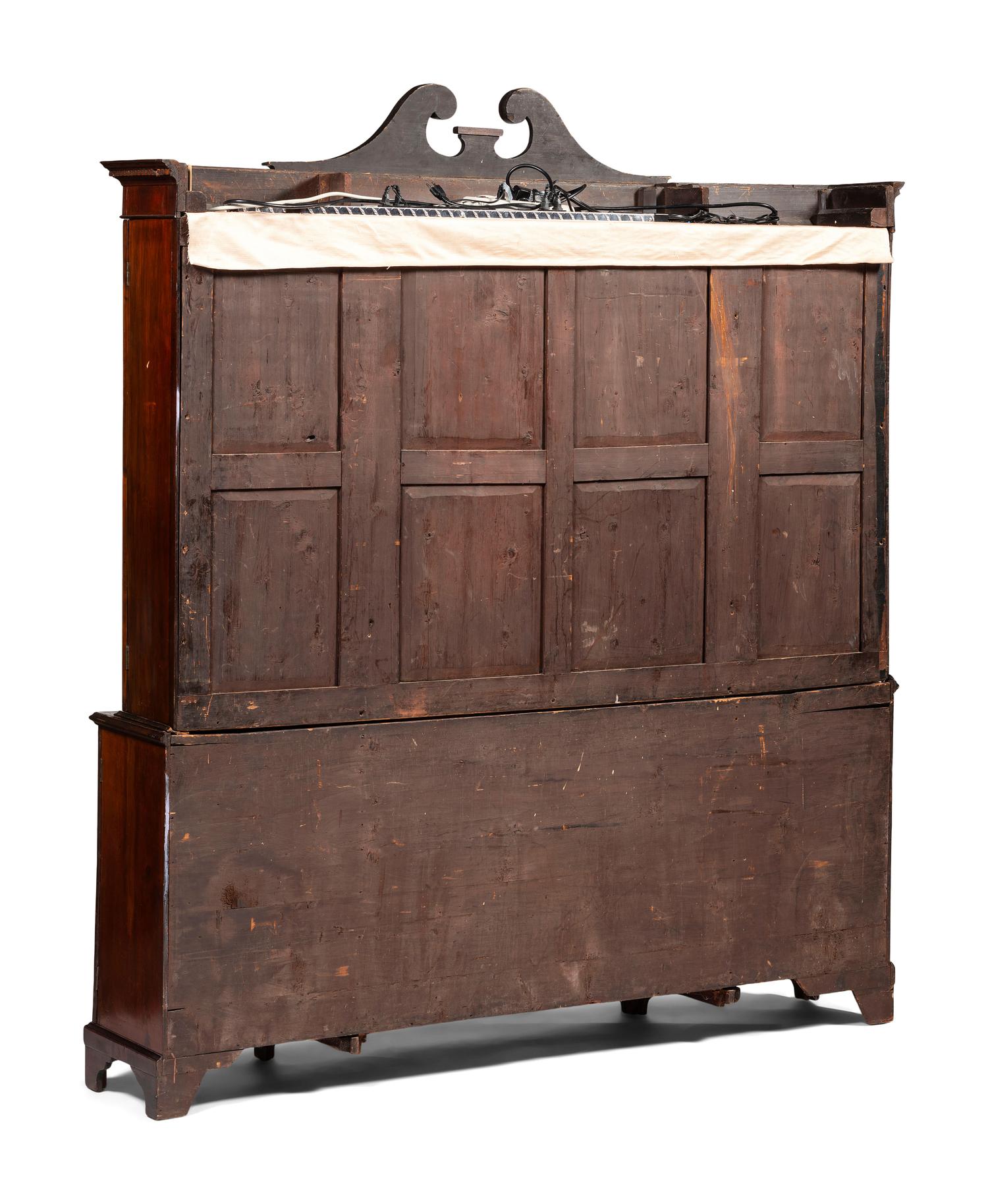 An English Mahogany and Marquetry Breakfront Bookcase