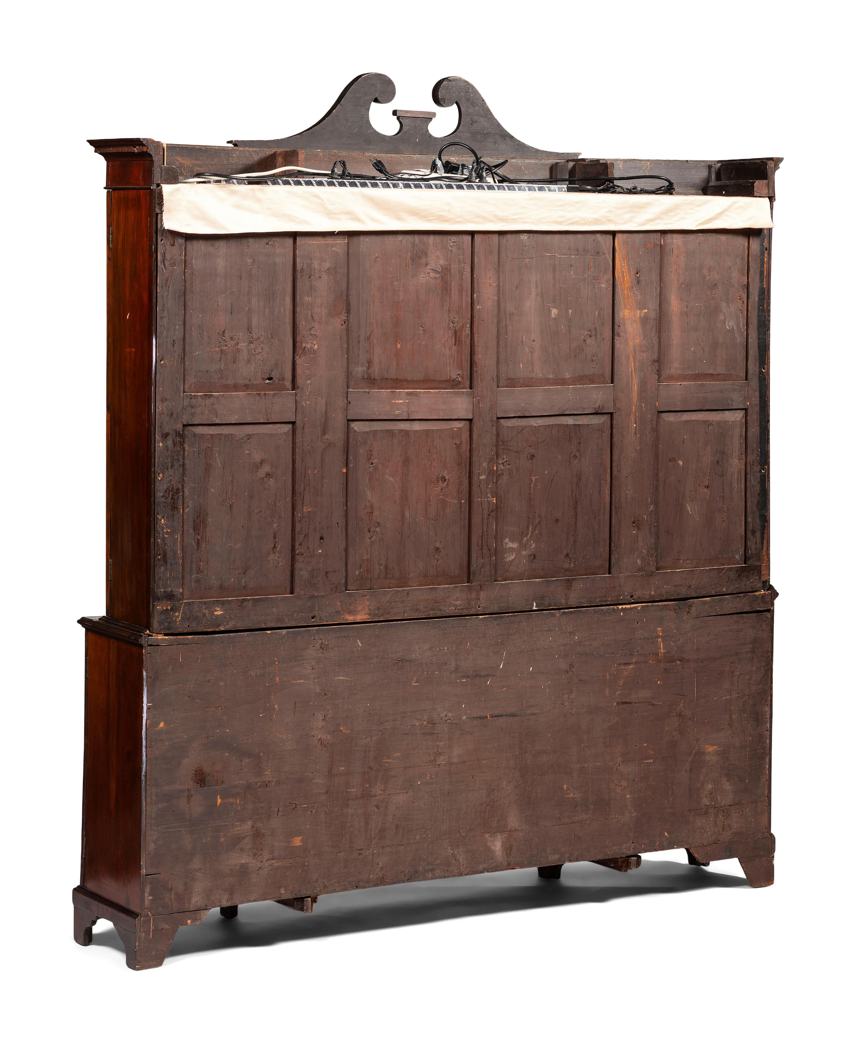 An English Mahogany and Marquetry Breakfront Bookcase