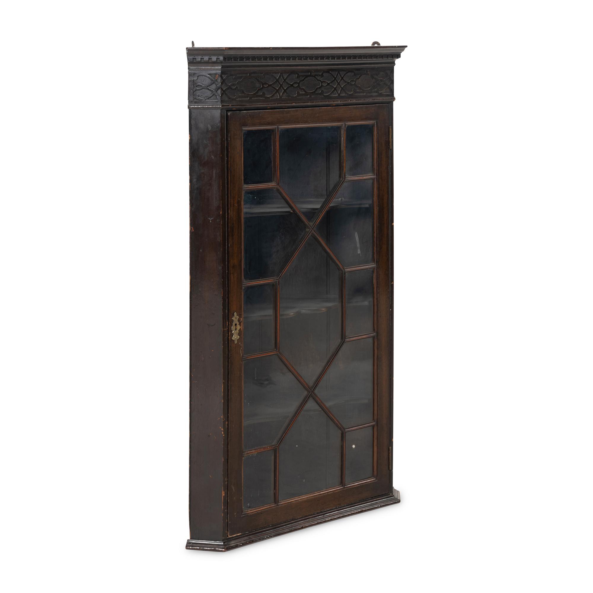 A George III Fret-Carved Mahogany Hanging Corner Cupboard