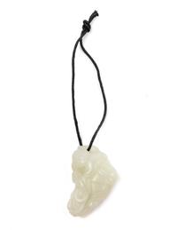 A Chinese Pale Celadon Jade Figure of a Child