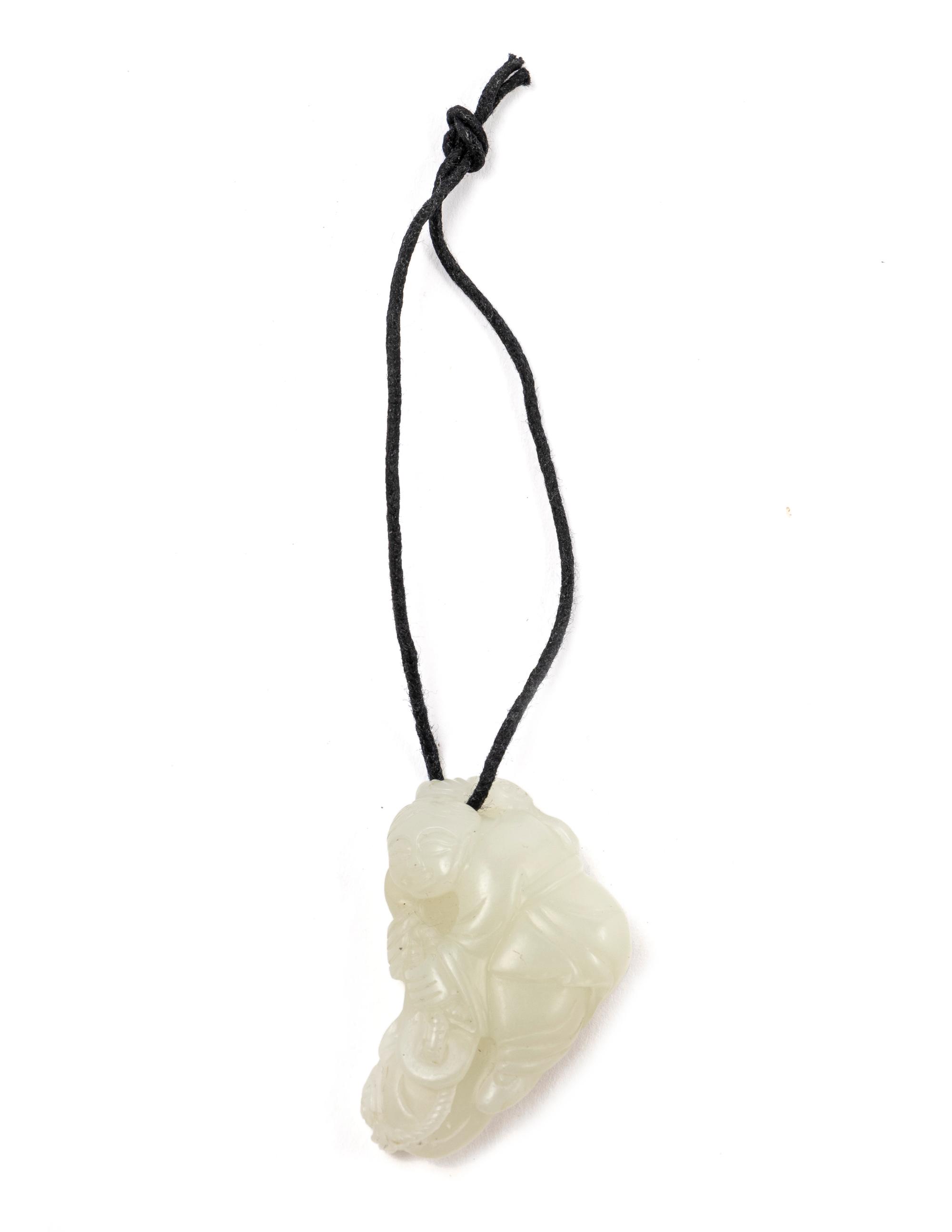 A Chinese Pale Celadon Jade Figure of a Child