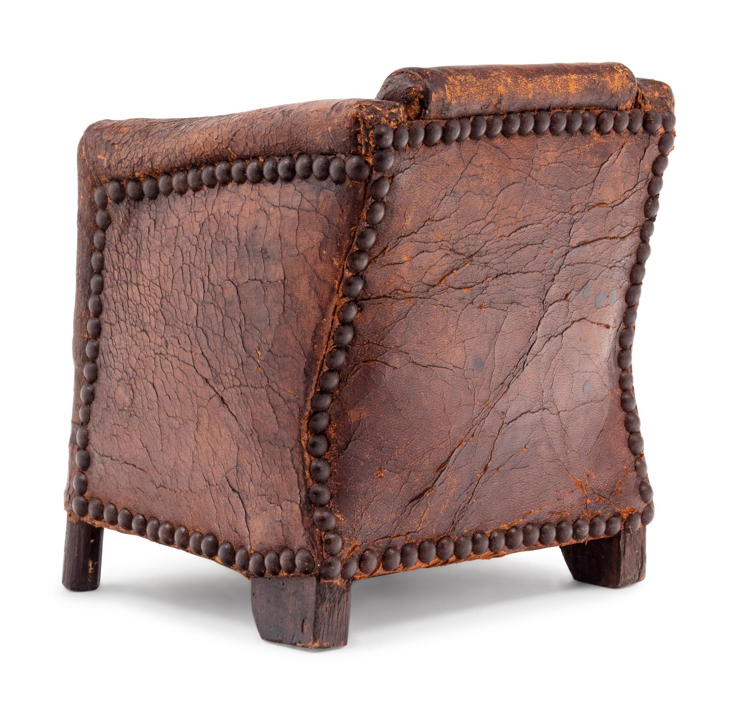 A Diminutive Leather Upholstered Club Chair