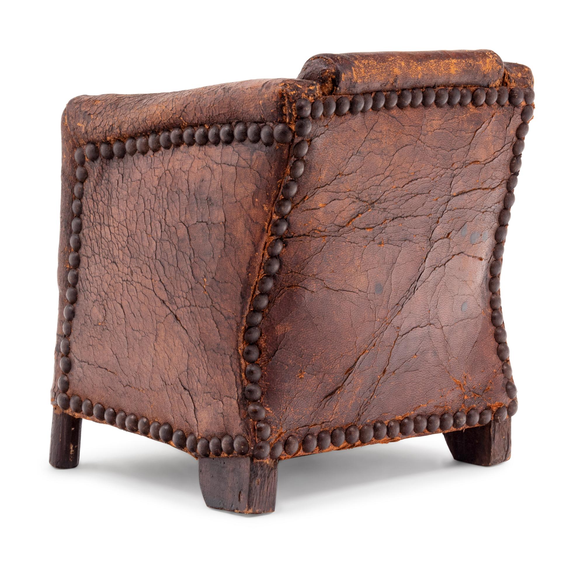 A Diminutive Leather Upholstered Club Chair