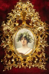 A Continental Porcelain Plaque in a Giltwood Frame