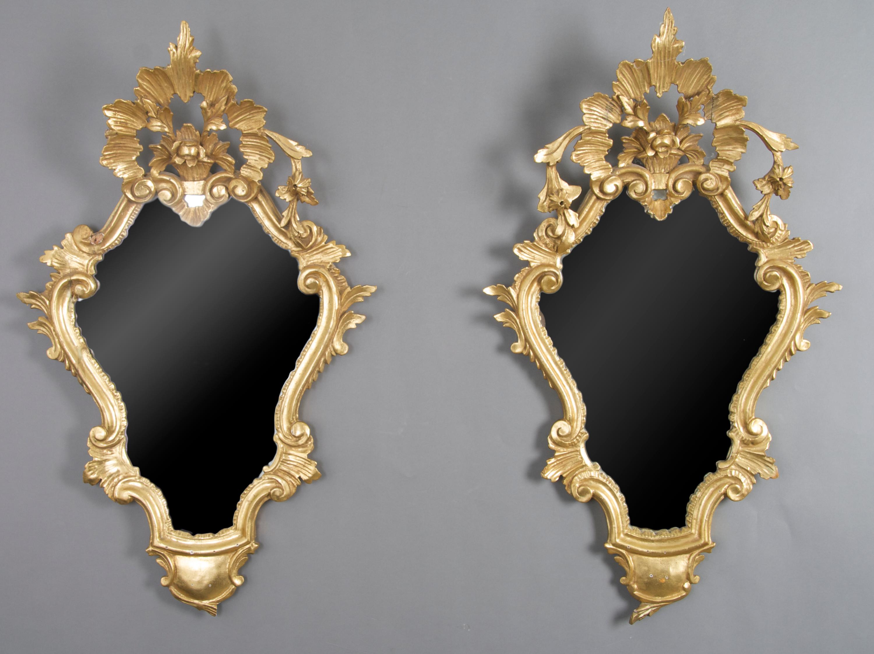 A Pair of Rococo Style Giltwood Mirrors, Height 28 x width 16 1/2 inches.