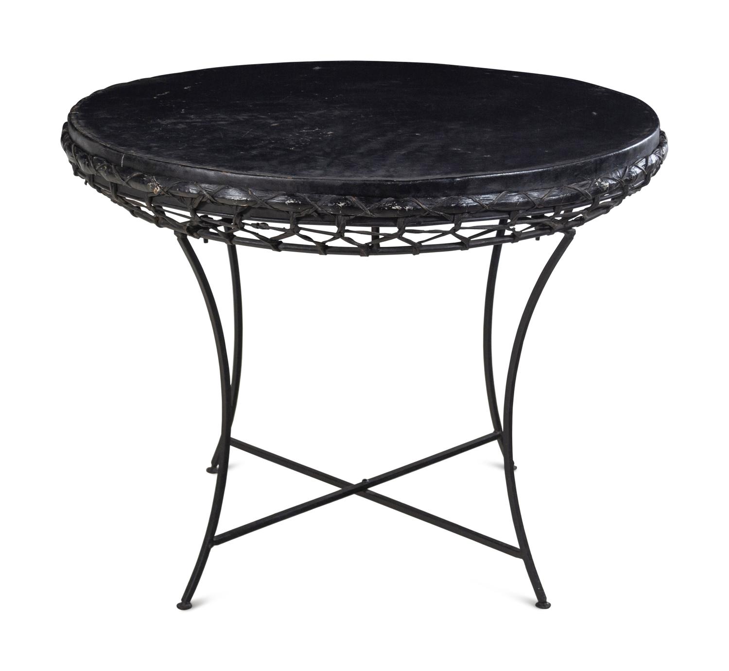 A Rustic Raffia and Hide Side Table with an Iron Base